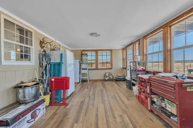 a bedroom with furniture and a window