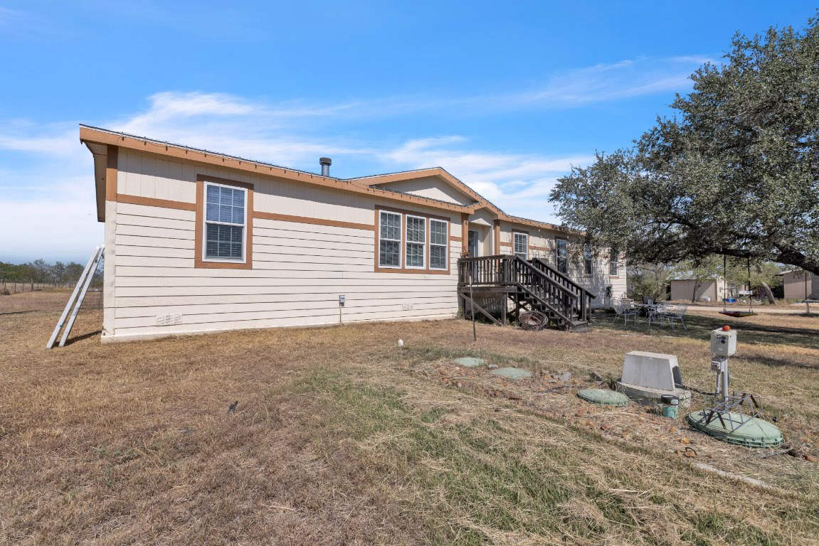 401 High Ridge Meadows Drive Gonzales, TX 78629 - Photo 25 of 31 a house view with a backyard space
