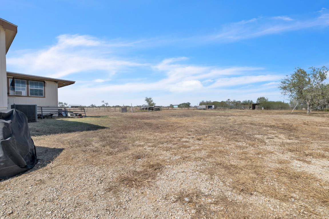 401 High Ridge Meadows Drive Gonzales, TX 78629 - Photo 27 of 31 a view of a lake with houses in the back