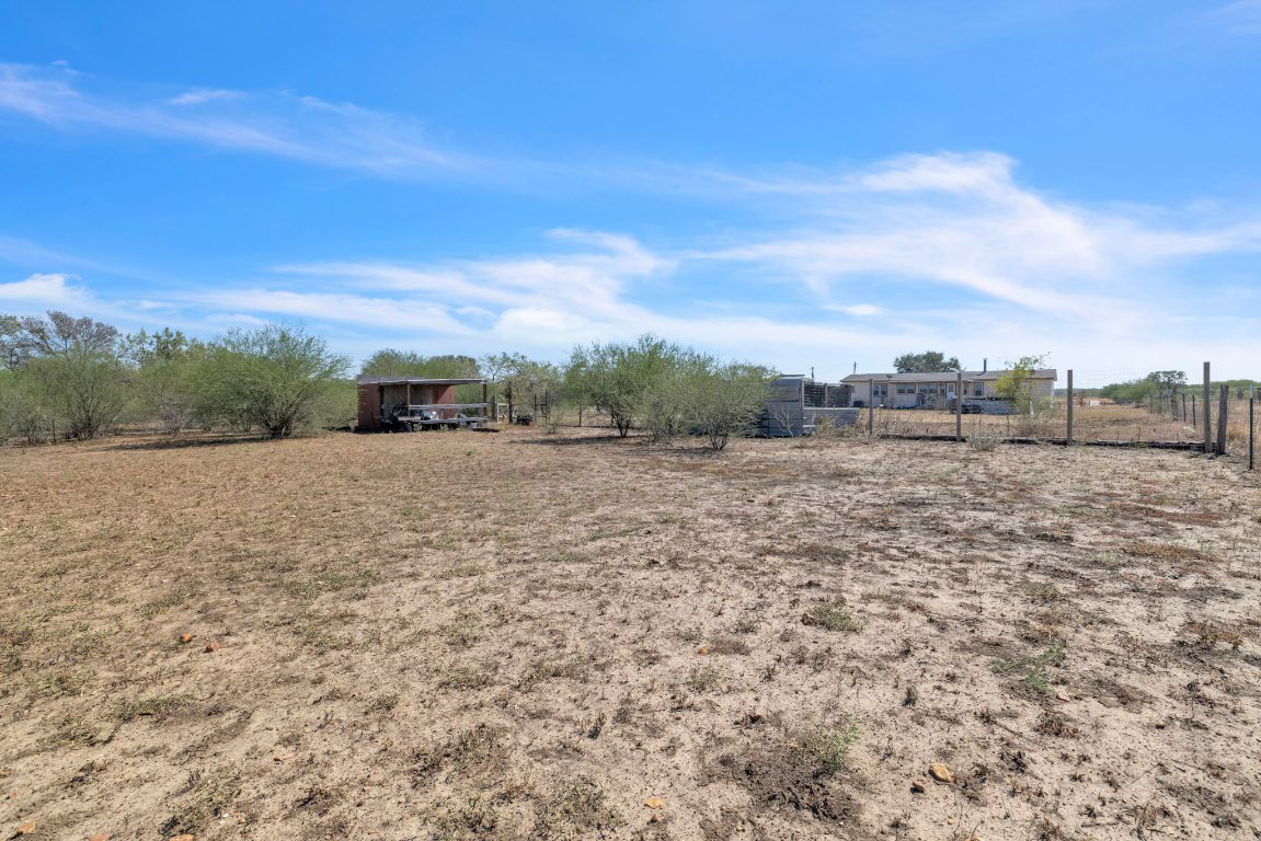 401 High Ridge Meadows Drive Gonzales, TX 78629 - Photo 29 of 31 a view of a dry yard with wooden fence