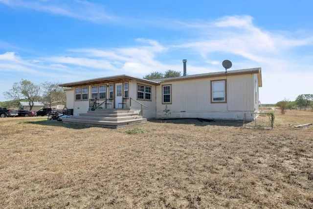 a house view with a garden space