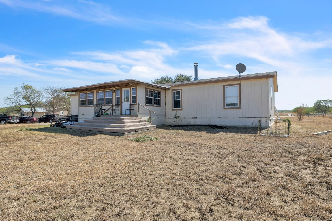 401 High Ridge Meadows Drive Gonzales, TX 78629 - Photo 30 of 31 a house view with a garden space
