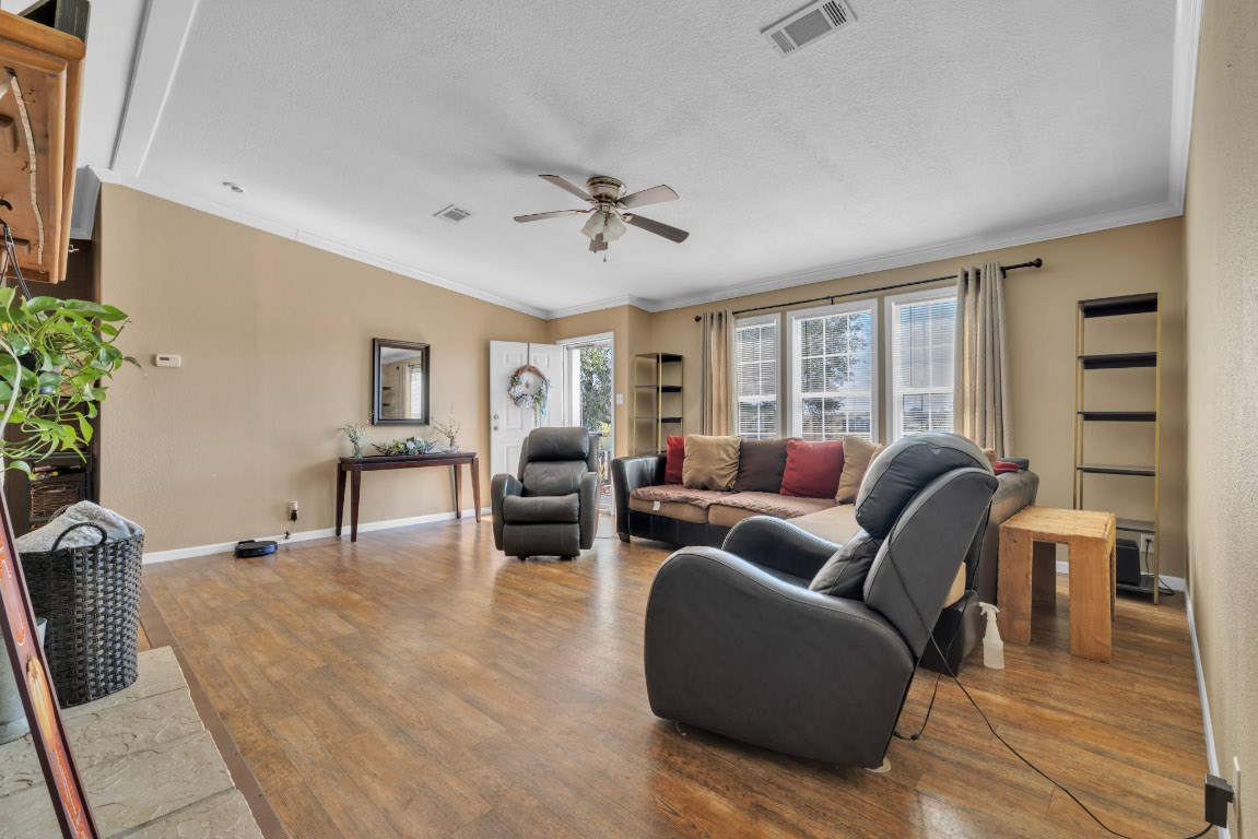 401 High Ridge Meadows Drive Gonzales, TX 78629 - Photo 10 of 31 a living room with furniture and wooden floor