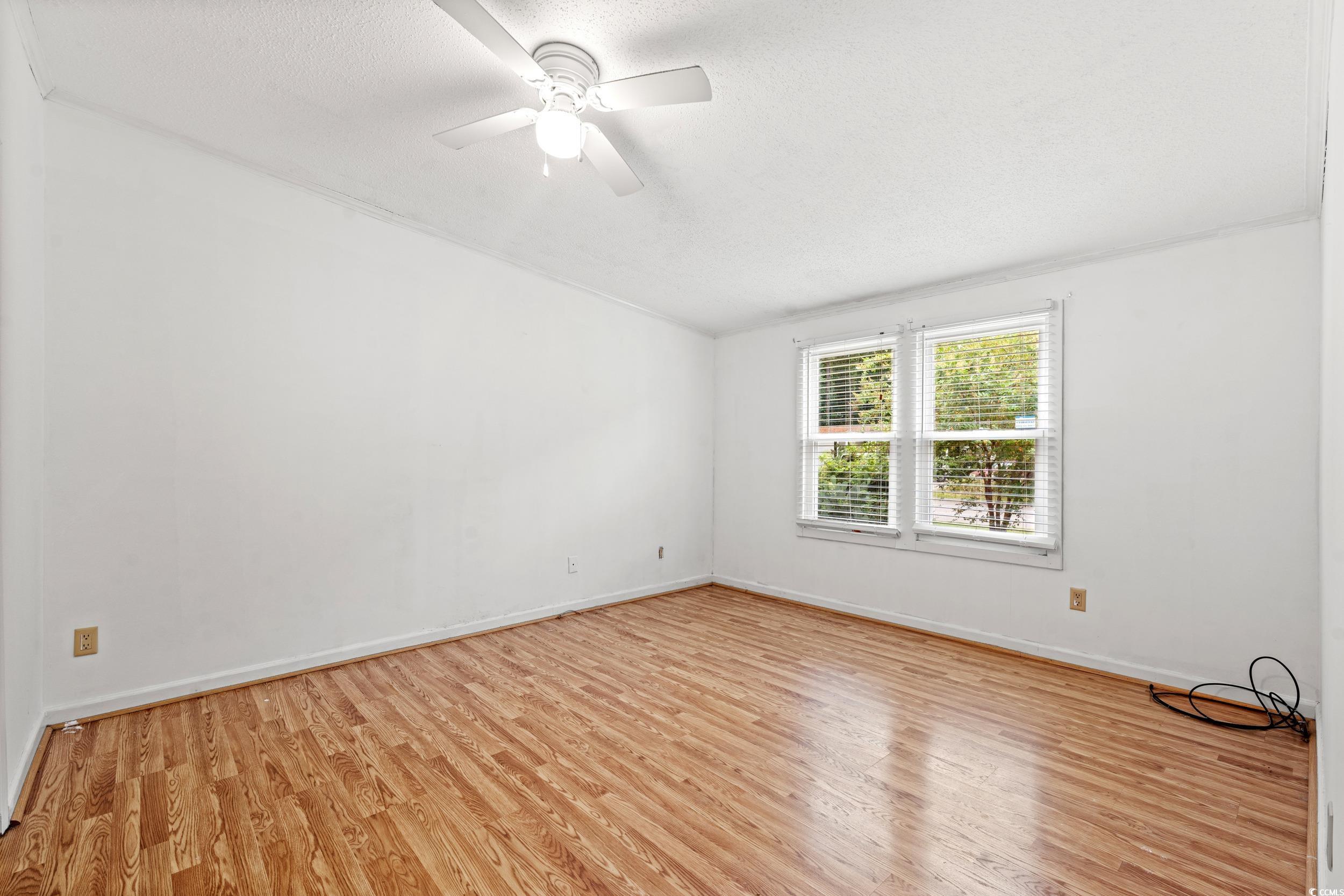 516 Grapevine Street Myrtle Beach, SC 29579 - Photo 12 of 33 Empty room featuring light wood-type flooring, cei