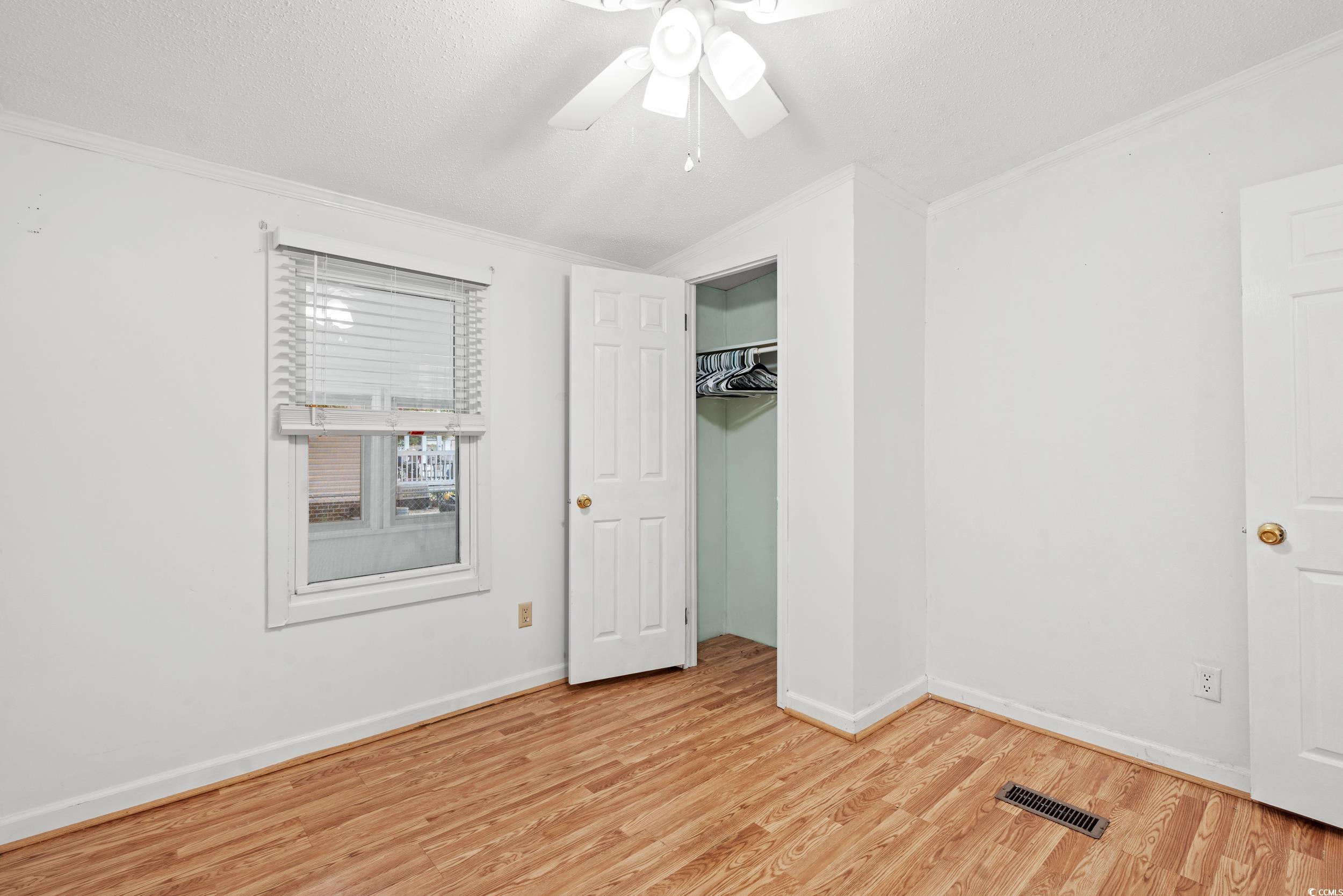 516 Grapevine Street Myrtle Beach, SC 29579 - Photo 18 of 33 Unfurnished bedroom with a textured ceiling, light