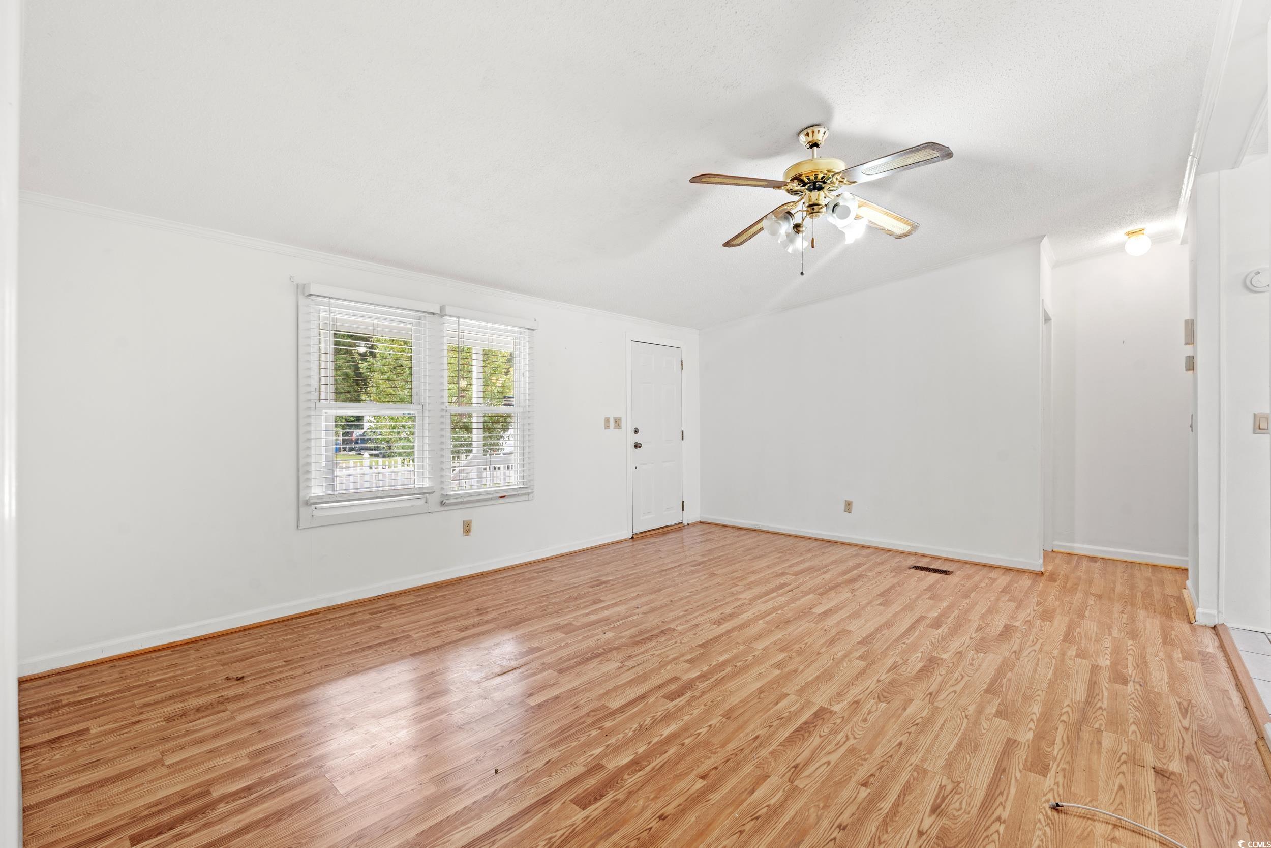 516 Grapevine Street Myrtle Beach, SC 29579 - Photo 5 of 33 Unfurnished room featuring ceiling fan and light h
