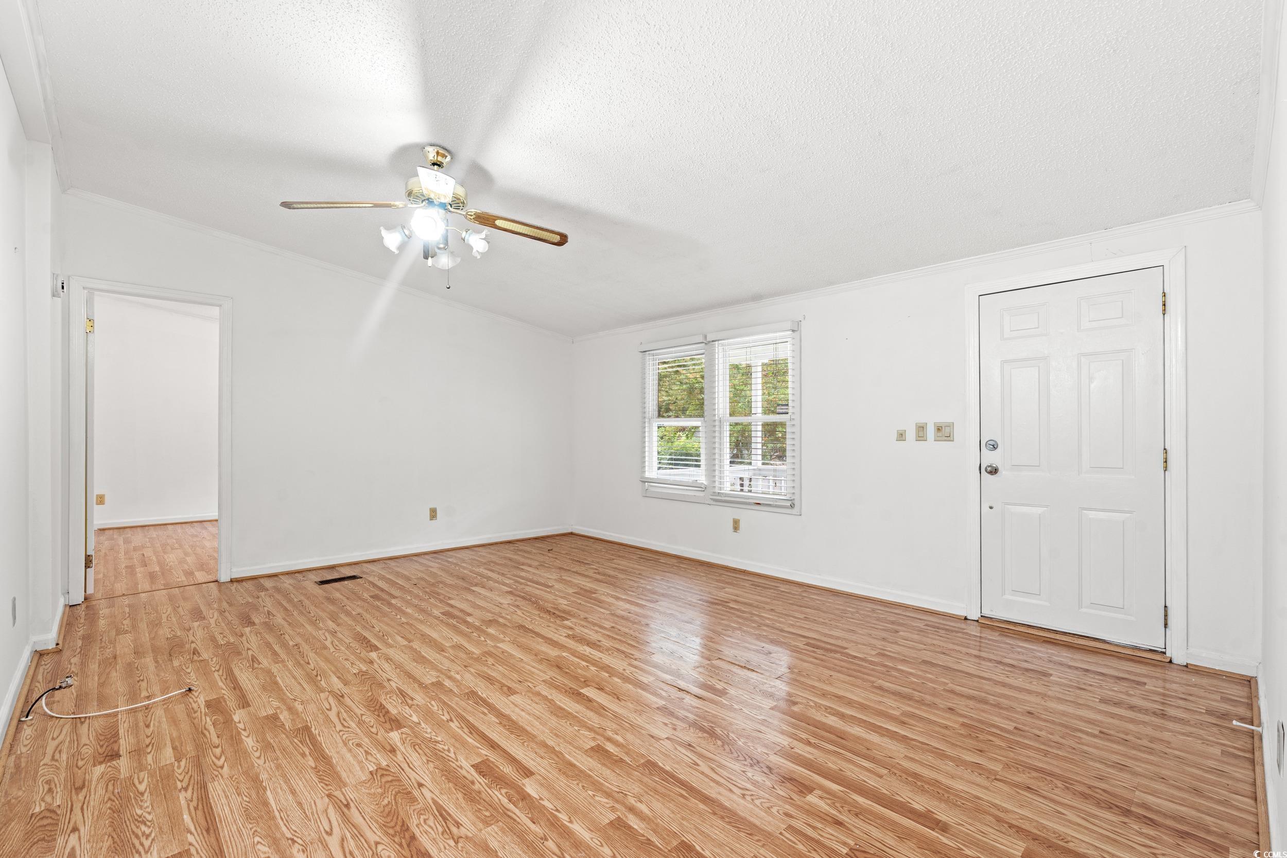 516 Grapevine Street Myrtle Beach, SC 29579 - Photo 6 of 33 Unfurnished room with ceiling fan, vaulted ceiling