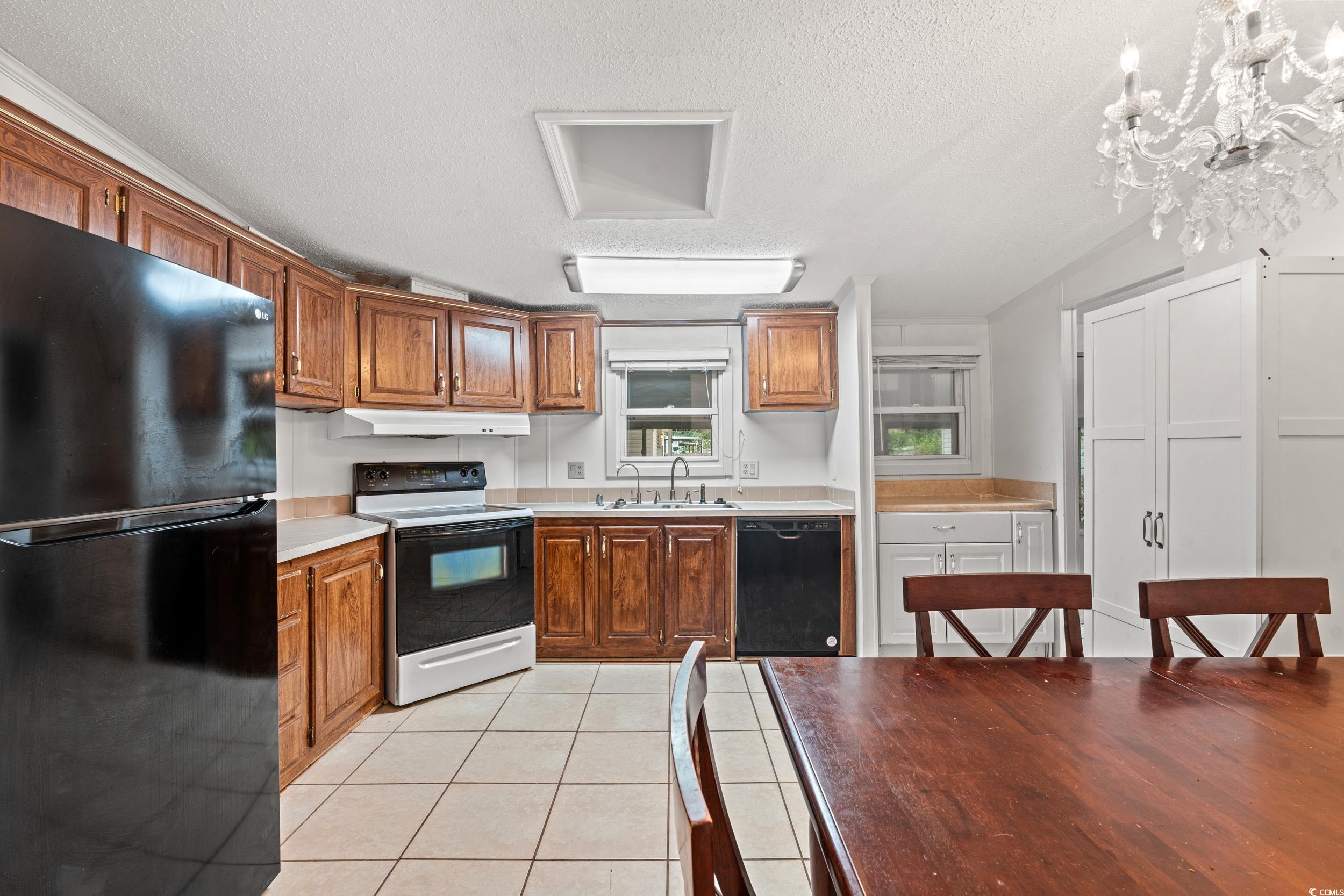 516 Grapevine Street Myrtle Beach, SC 29579 - Photo 9 of 33 Kitchen featuring a textured ceiling, black applia