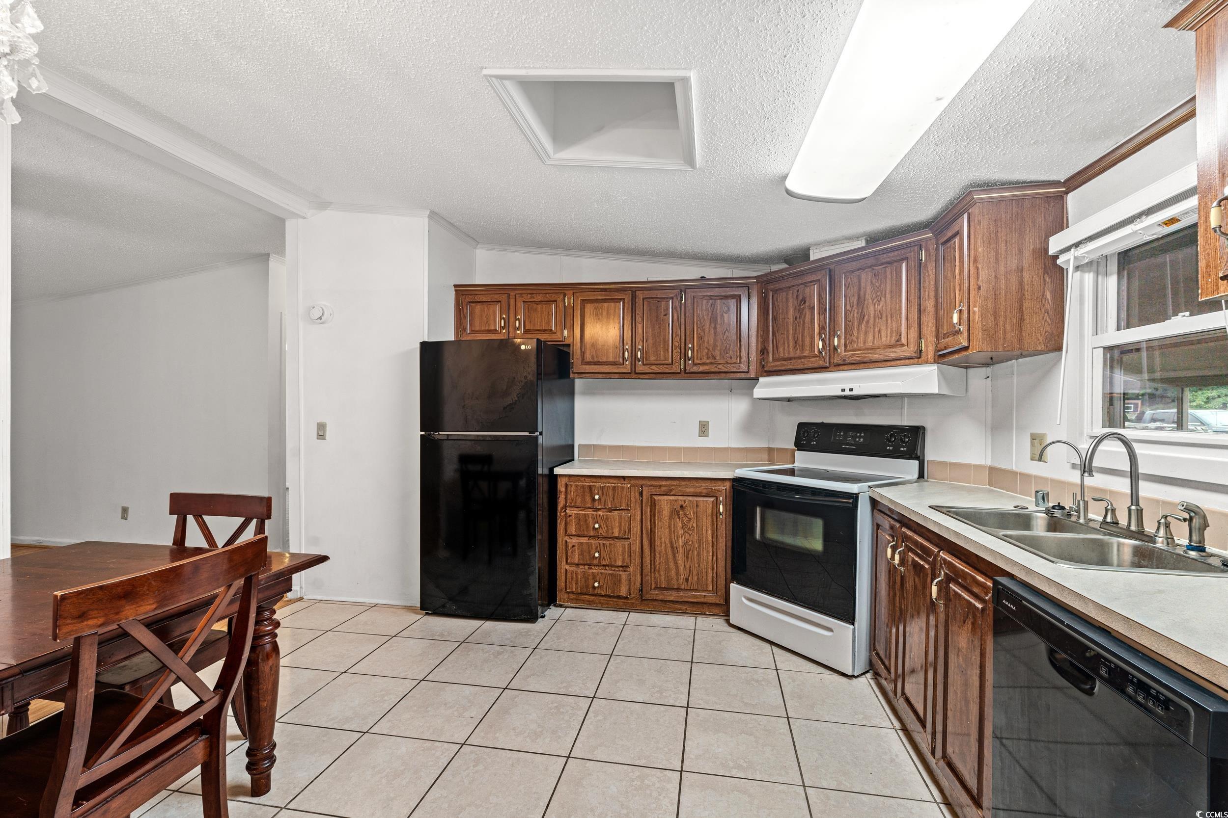 516 Grapevine Street Myrtle Beach, SC 29579 - Photo 10 of 33 Kitchen with a textured ceiling, light tile patter