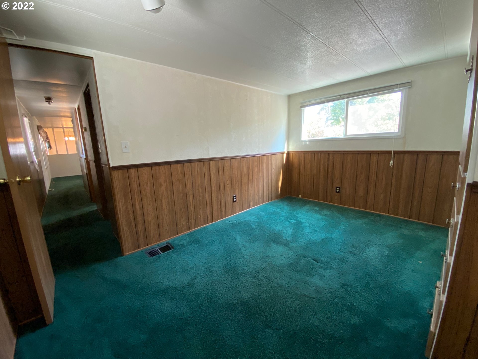 1475 Green Acres Road, Unit 165 Eugene, OR 97408 - Photo 11 of 14 wooden floor in an empty room