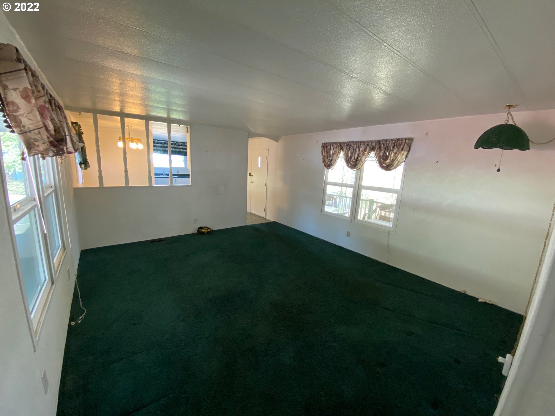 1475 Green Acres Road, Unit 165 Eugene, OR 97408 - Photo 7 of 14 a view of an empty room with a window