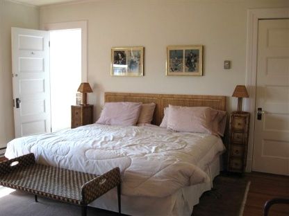 383 Rose Hill Road Water Mill, NY 11976 - Photo 12 of 13 a bedroom with a bed and wooden floor