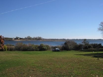 383 Rose Hill Road Water Mill, NY 11976 - Photo 3 of 13 a view of a lake with a yard
