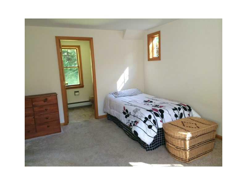 18 Howards Hill Road Harpswell, ME 04079 - Photo 23 of 31 Bedroom. An en suite bathroom,...
