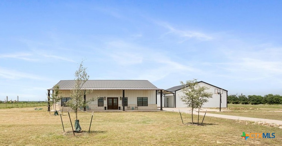 1490 Dos Hermanas Road Salado, TX 76571 - Photo 1 of 43 a front view of a house with a yard