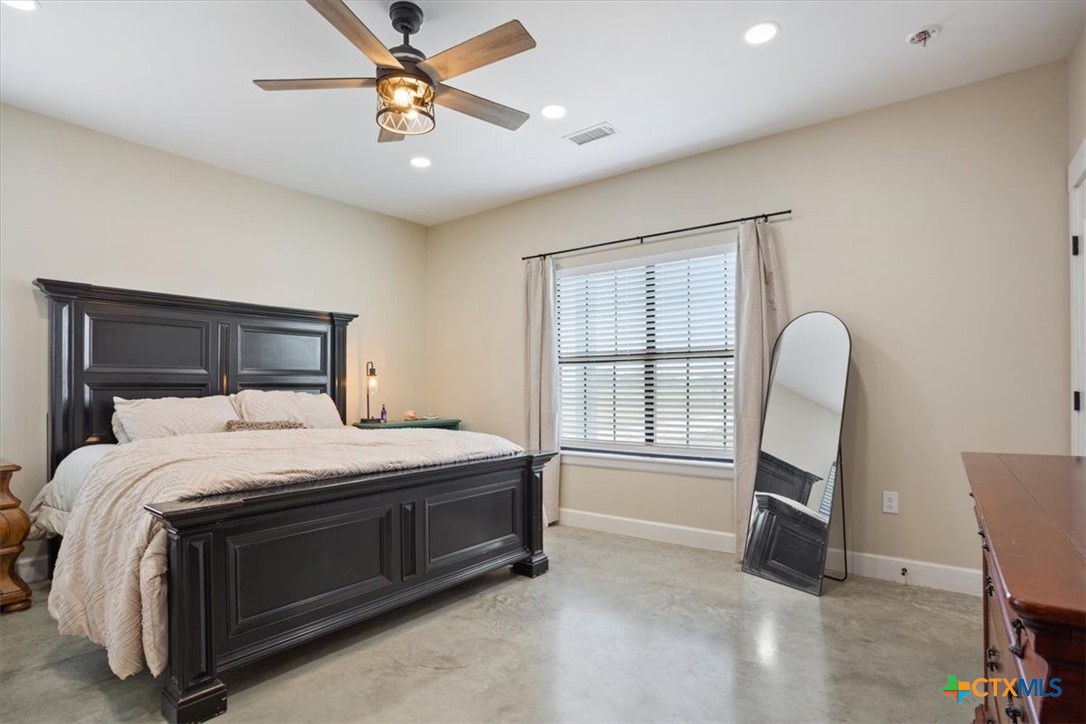 1490 Dos Hermanas Road Salado, TX 76571 - Photo 17 of 43 a bedroom with a bed and a window