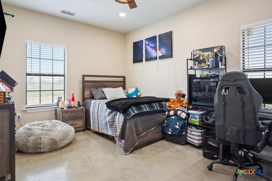 1490 Dos Hermanas Road Salado, TX 76571 - Photo 24 of 43 a bedroom with bed and a window