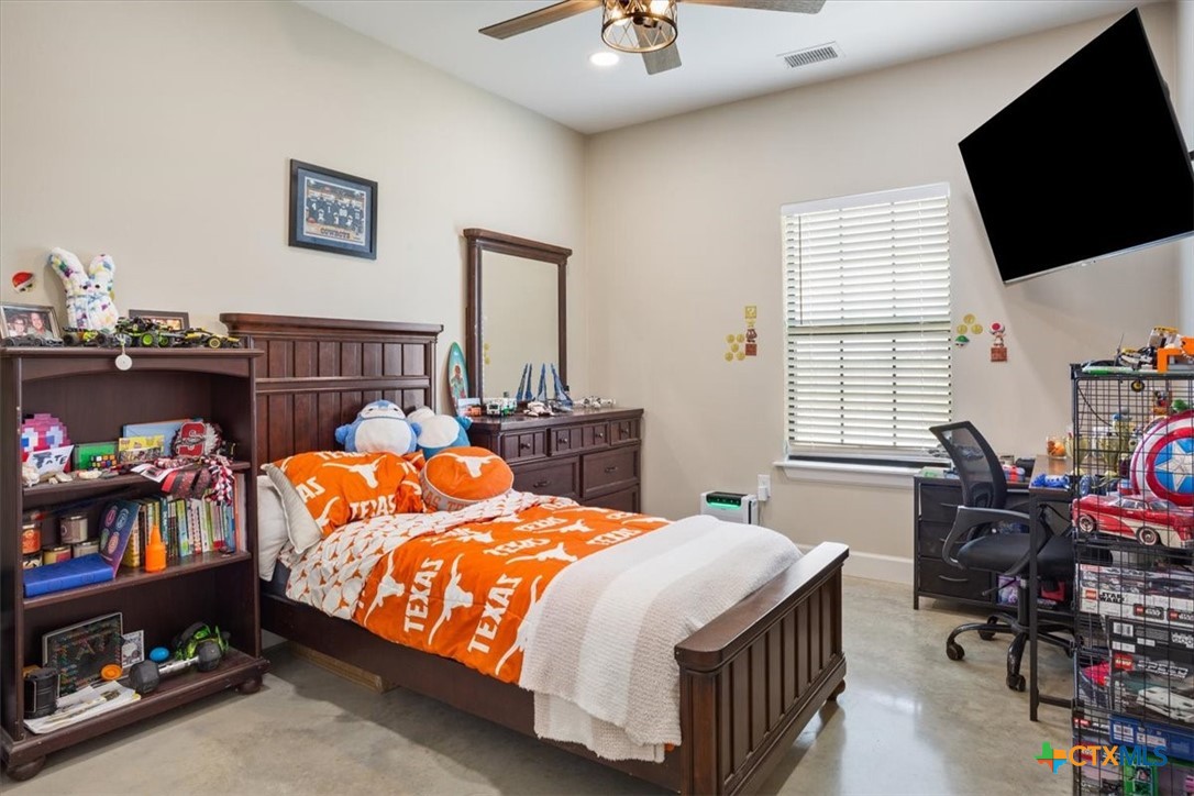 1490 Dos Hermanas Road Salado, TX 76571 - Photo 27 of 43 a bed room with a bed and a tv