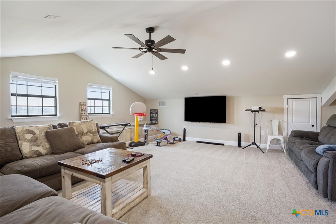 1490 Dos Hermanas Road Salado, TX 76571 - Photo 28 of 43 a living room with furniture and a flat screen tv
