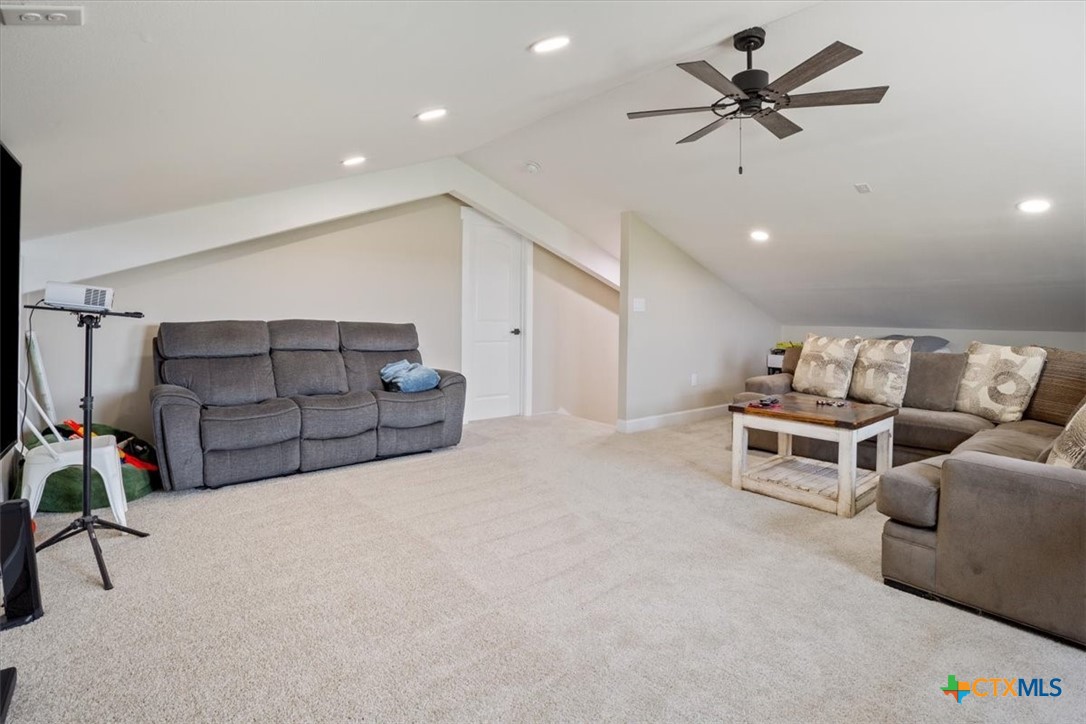 1490 Dos Hermanas Road Salado, TX 76571 - Photo 29 of 43 a living room with furniture and a flat screen tv