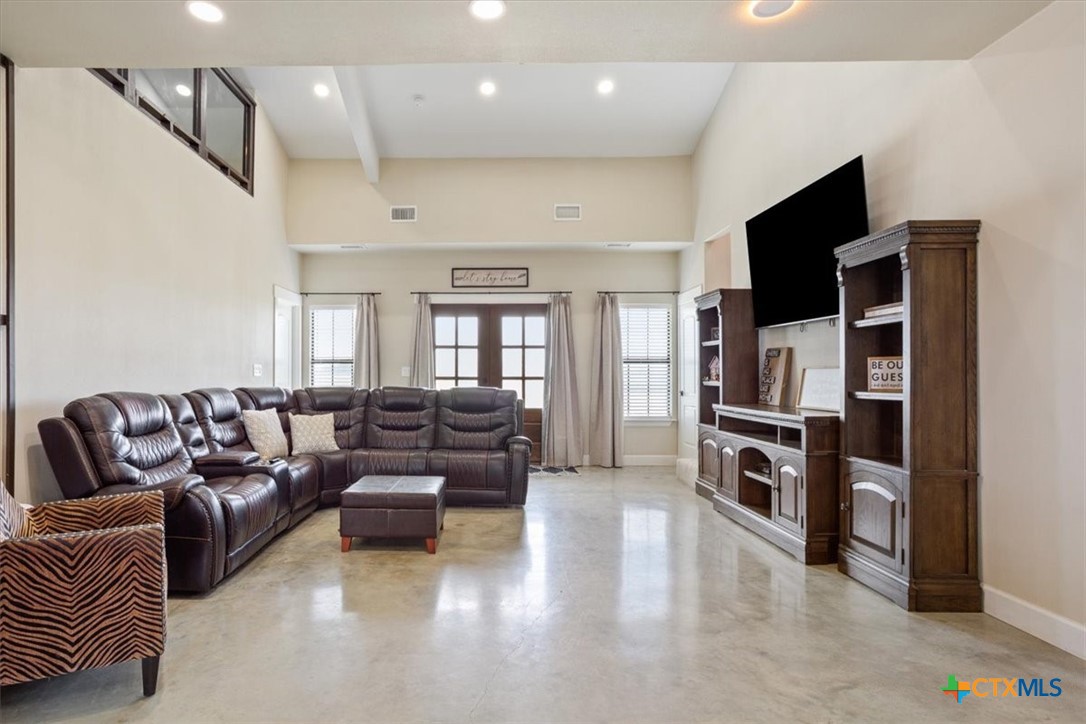 1490 Dos Hermanas Road Salado, TX 76571 - Photo 9 of 43 a living room with furniture and a flat screen tv