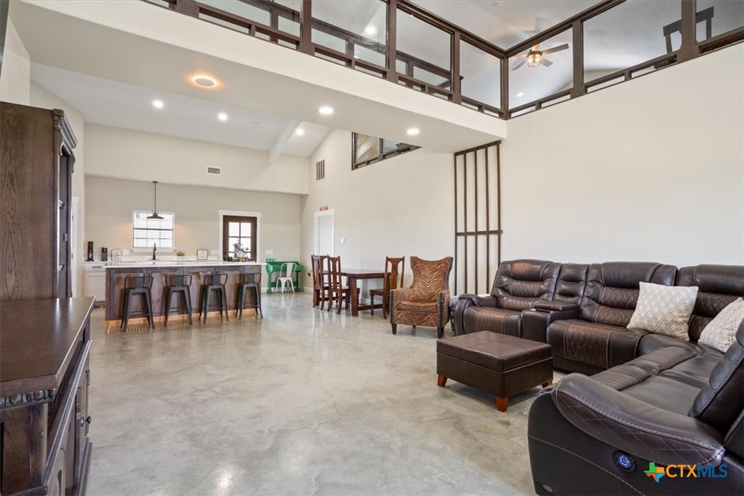 1490 Dos Hermanas Road Salado, TX 76571 - Photo 10 of 43 a living room with furniture and a table
