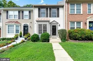 a front view of a house with garden and porch