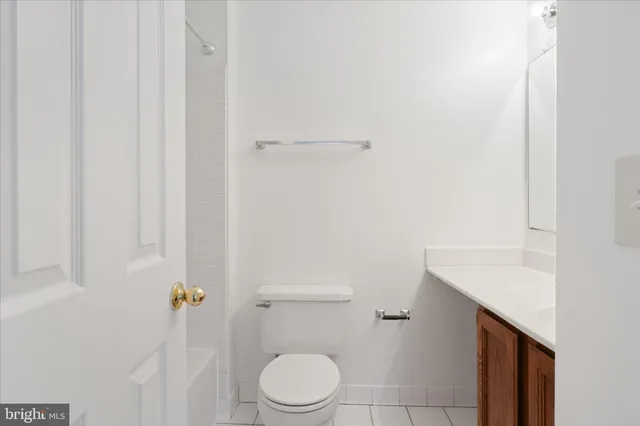 a white toilet sitting next to a white sink