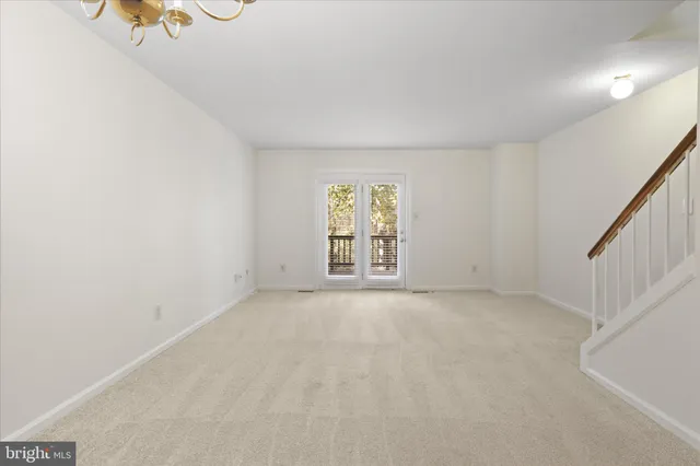 a view of an empty room with windows