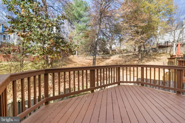 a view of wooden balcony with wooden floor and fence