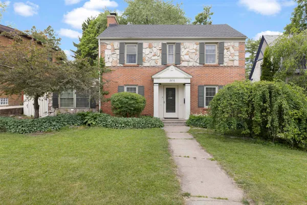 a front view of a house with garden
