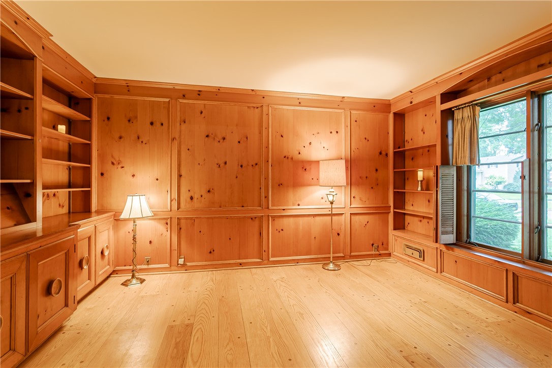 200 Monteroy Road Brighton, NY 14618 - Photo 18 of 41 Wood paneled den with built-ins & closet