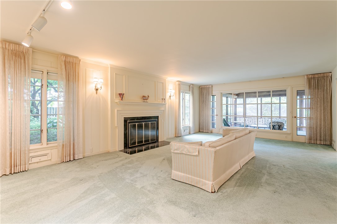 200 Monteroy Road Brighton, NY 14618 - Photo 8 of 41 Formal living room with fireplace (hardwoods under