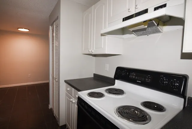 a kitchen with a stove and a refrigerator