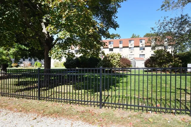 a view of a yard with a street of the house