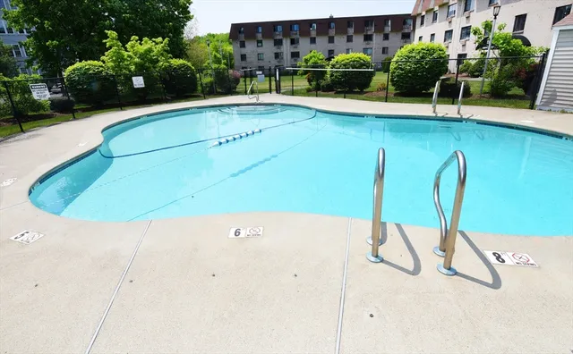 a view of swimming pool with a bench