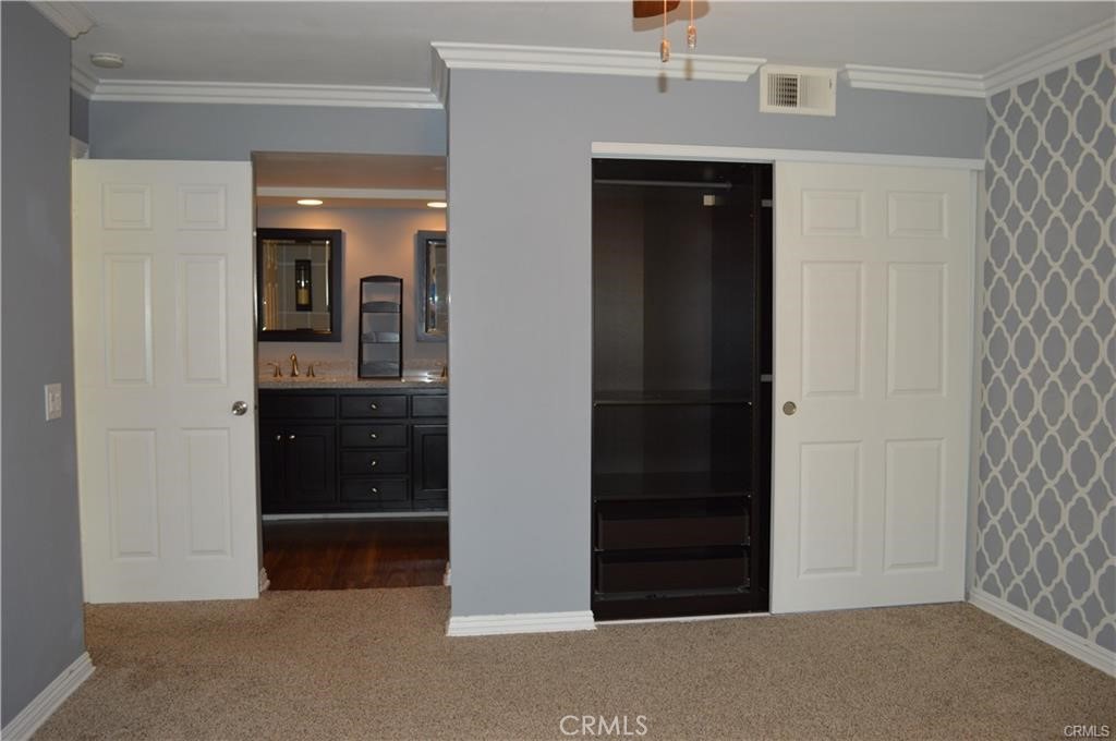 64 Lobelia Rancho Santa Margarita, CA 92688 - Photo 8 of 14 Primary closet and Bathroom