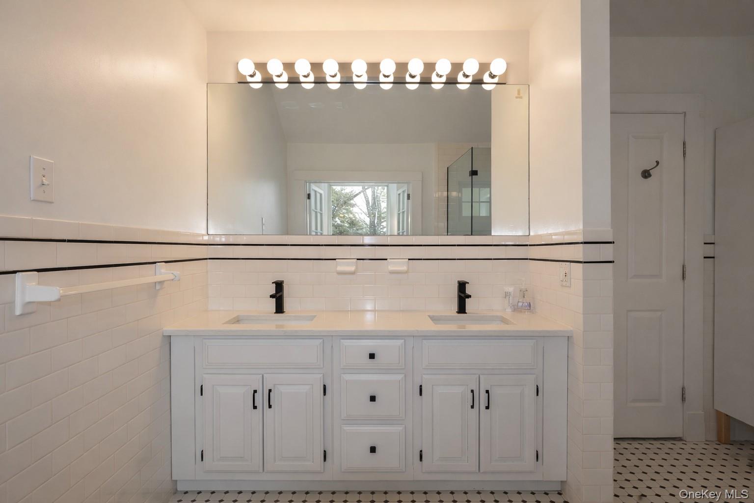 16 Clinton Avenue Dobbs Ferry, NY 10522 - Photo 19 of 26 a bathroom with a sink and a mirror