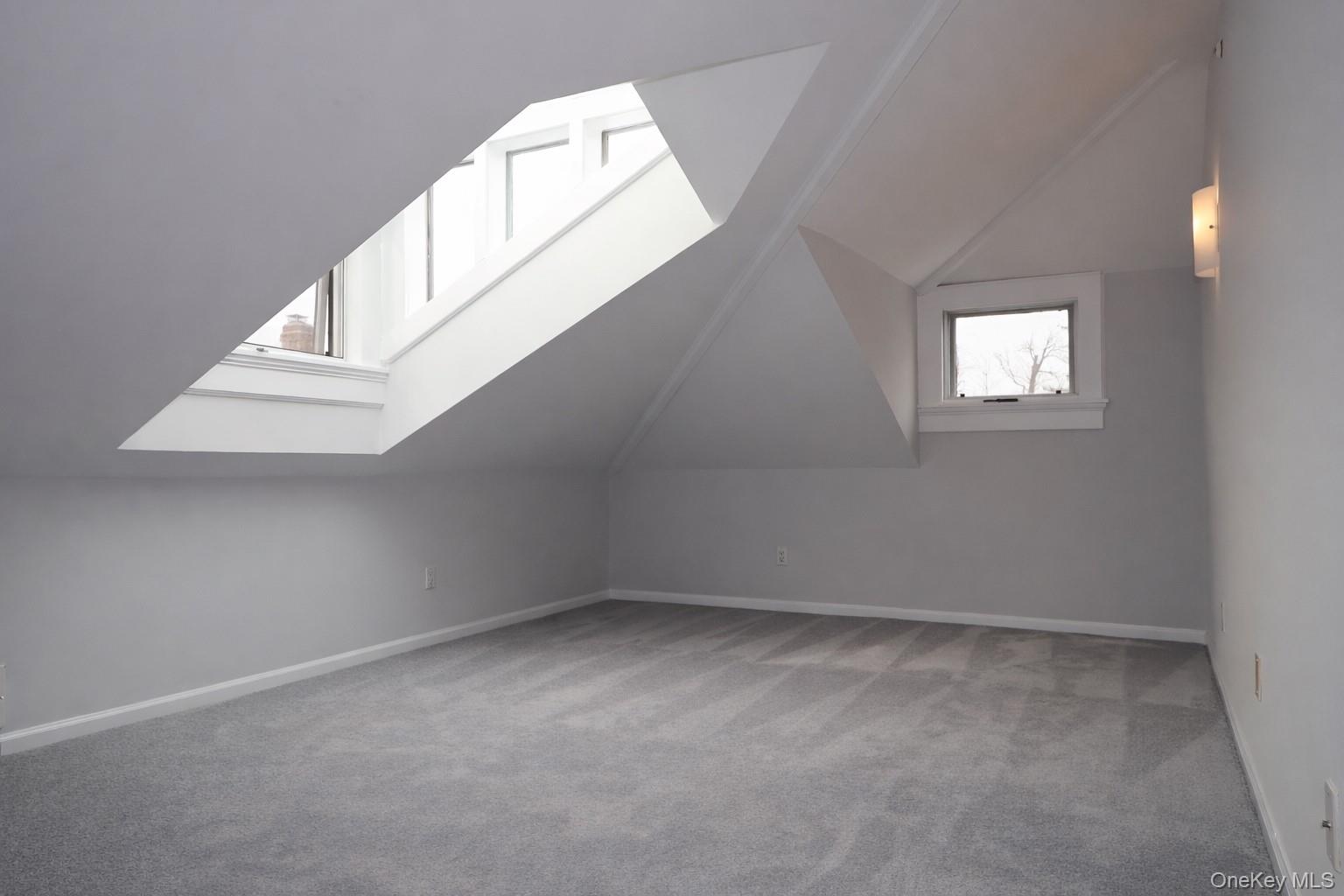 16 Clinton Avenue Dobbs Ferry, NY 10522 - Photo 20 of 26 an empty room with windows