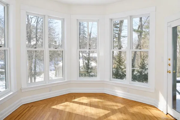 a view of a bedroom with a large window and bed