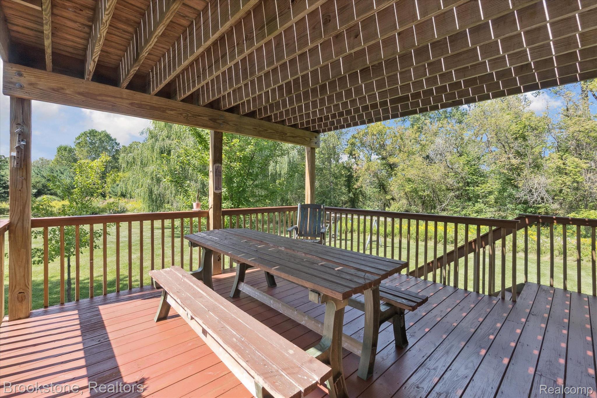 13962 South Beardslee Road Perry, MI 48872 - Photo 42 of 56 Wooden deck featuring a yard and outdoor dining space