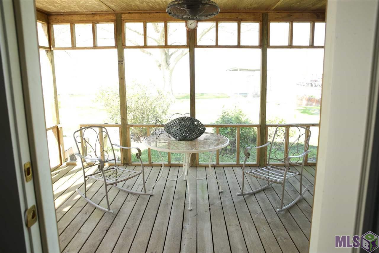 45038 Lakeside Road Gueydan, LA 70542 - Photo 19 of 37 Screened porch