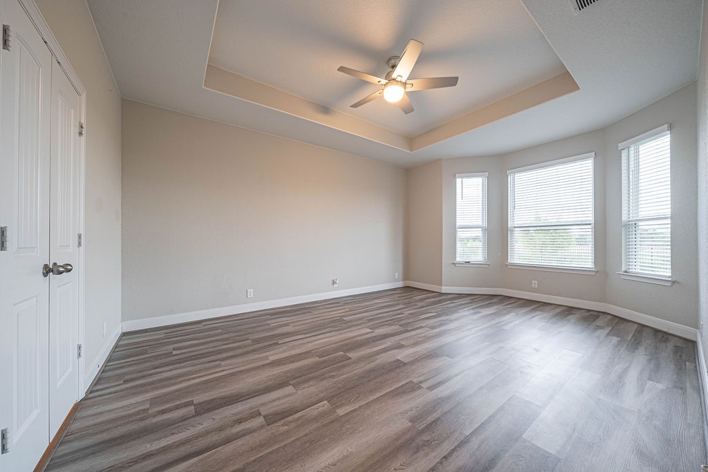 830 Rench New Braunfels, TX 78130 - Photo 19 of 50 a view of an empty room with wooden floor and a window