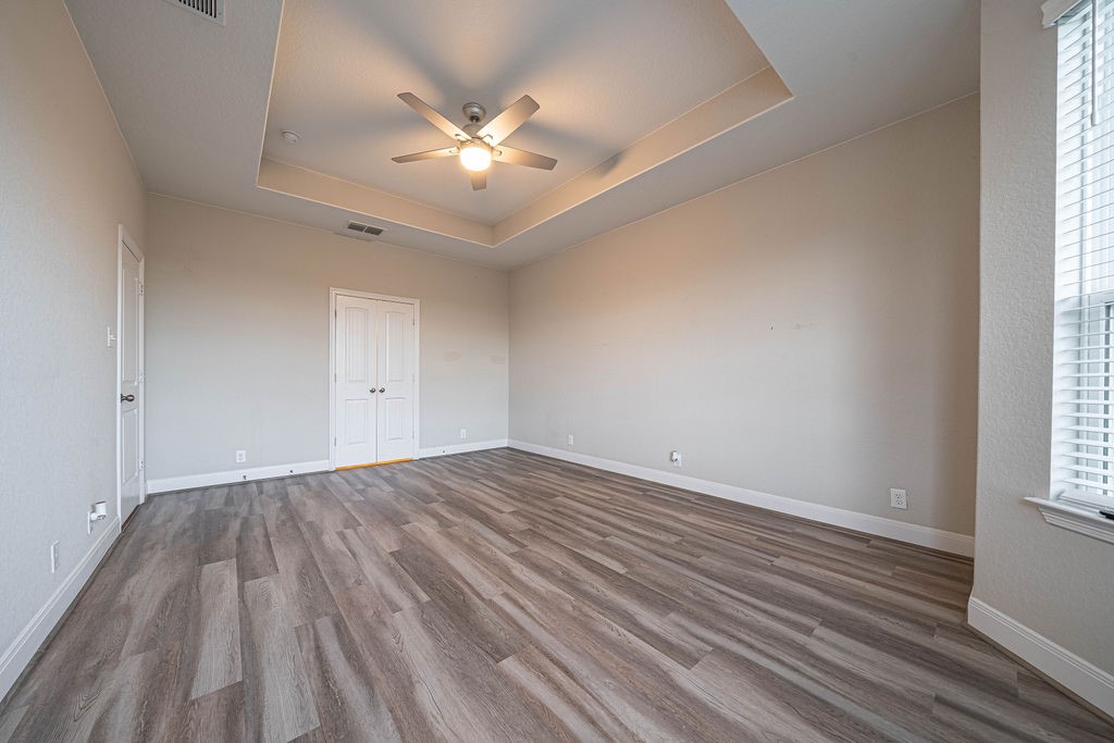 830 Rench New Braunfels, TX 78130 - Photo 21 of 50 an empty room with wooden floor and windows