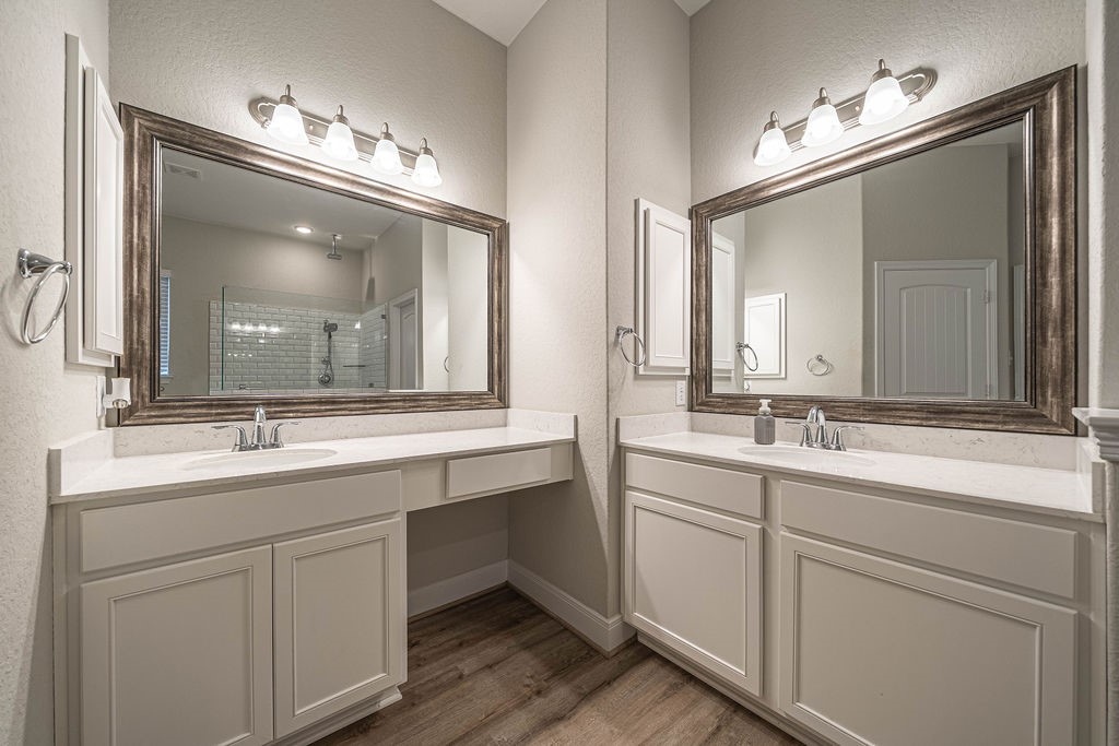 830 Rench New Braunfels, TX 78130 - Photo 23 of 50 a bathroom with a double vanity sink and a mirror