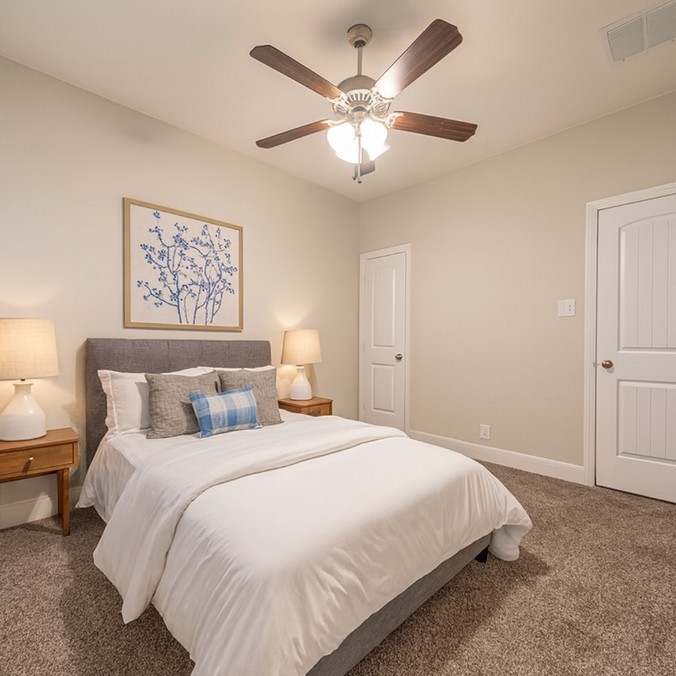 830 Rench New Braunfels, TX 78130 - Photo 28 of 50 a large bed sitting in a bedroom and chandelier