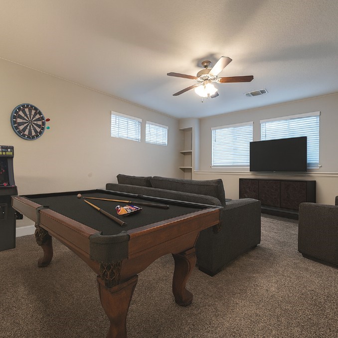 830 Rench New Braunfels, TX 78130 - Photo 35 of 50 a living room with furniture and a flat screen tv