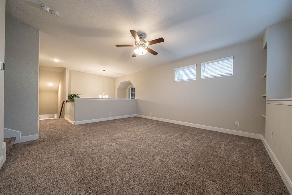 830 Rench New Braunfels, TX 78130 - Photo 38 of 50 a view of a livingroom with a ceiling fan and window