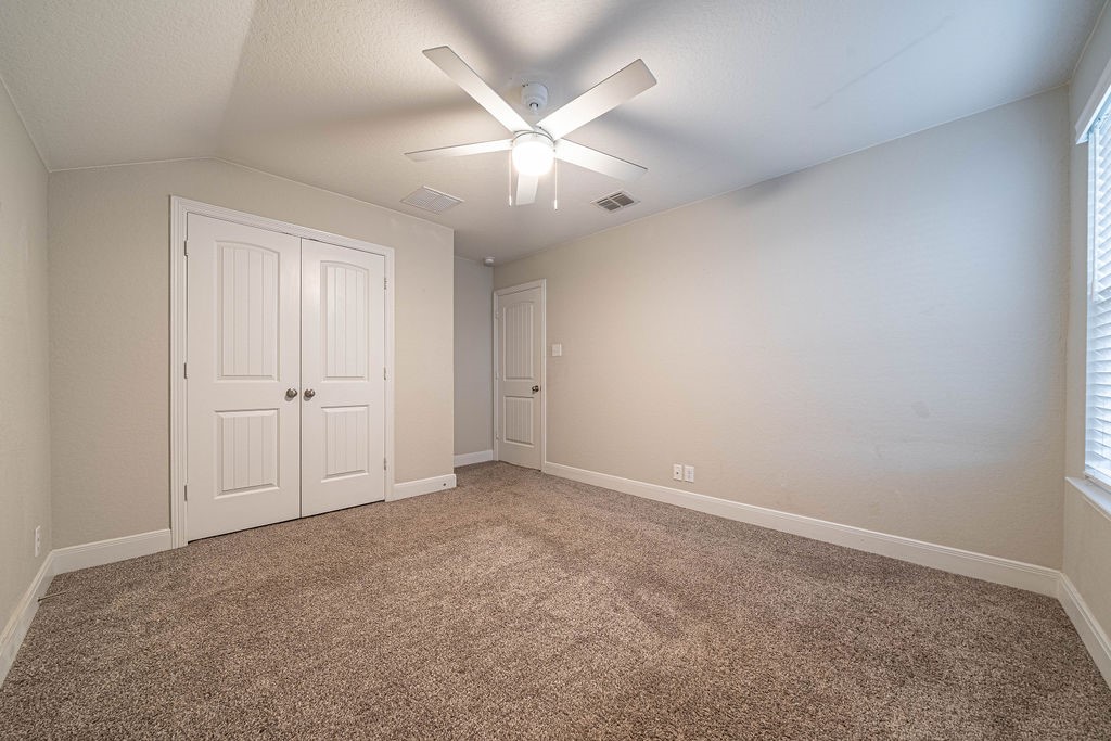 830 Rench New Braunfels, TX 78130 - Photo 41 of 50 an empty room with closet and windows
