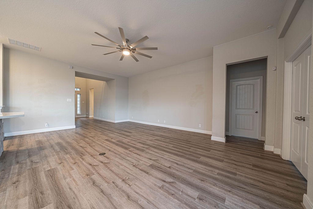 830 Rench New Braunfels, TX 78130 - Photo 7 of 50 a view of empty room with wooden floor